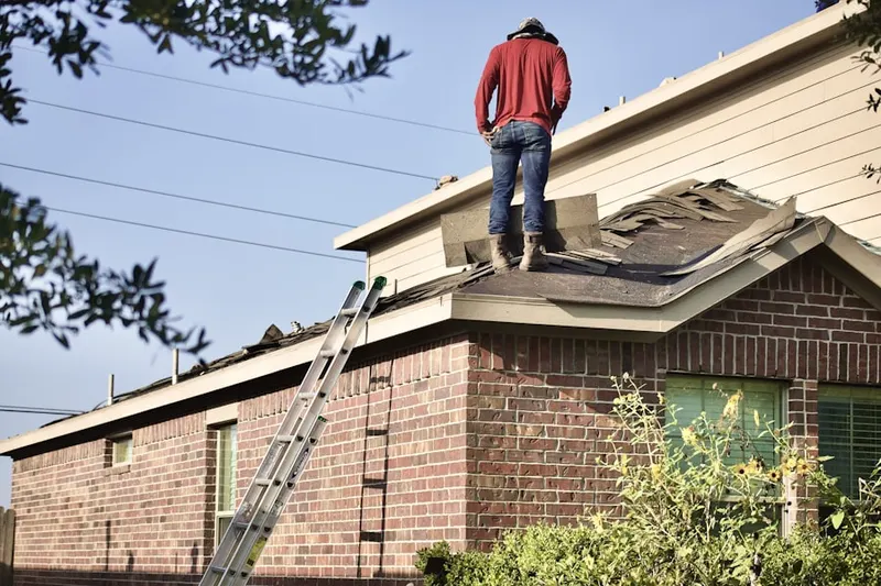 Professional roofer working on a residential roof in Downtown Ventura